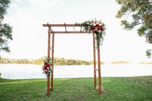 red white rose wedding floral arch